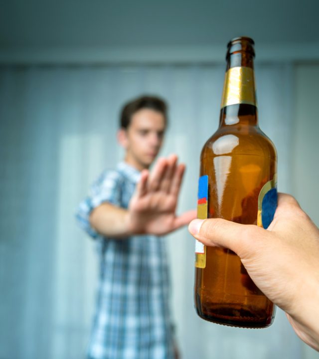 Man hand rejecting alcoholic beer beverage